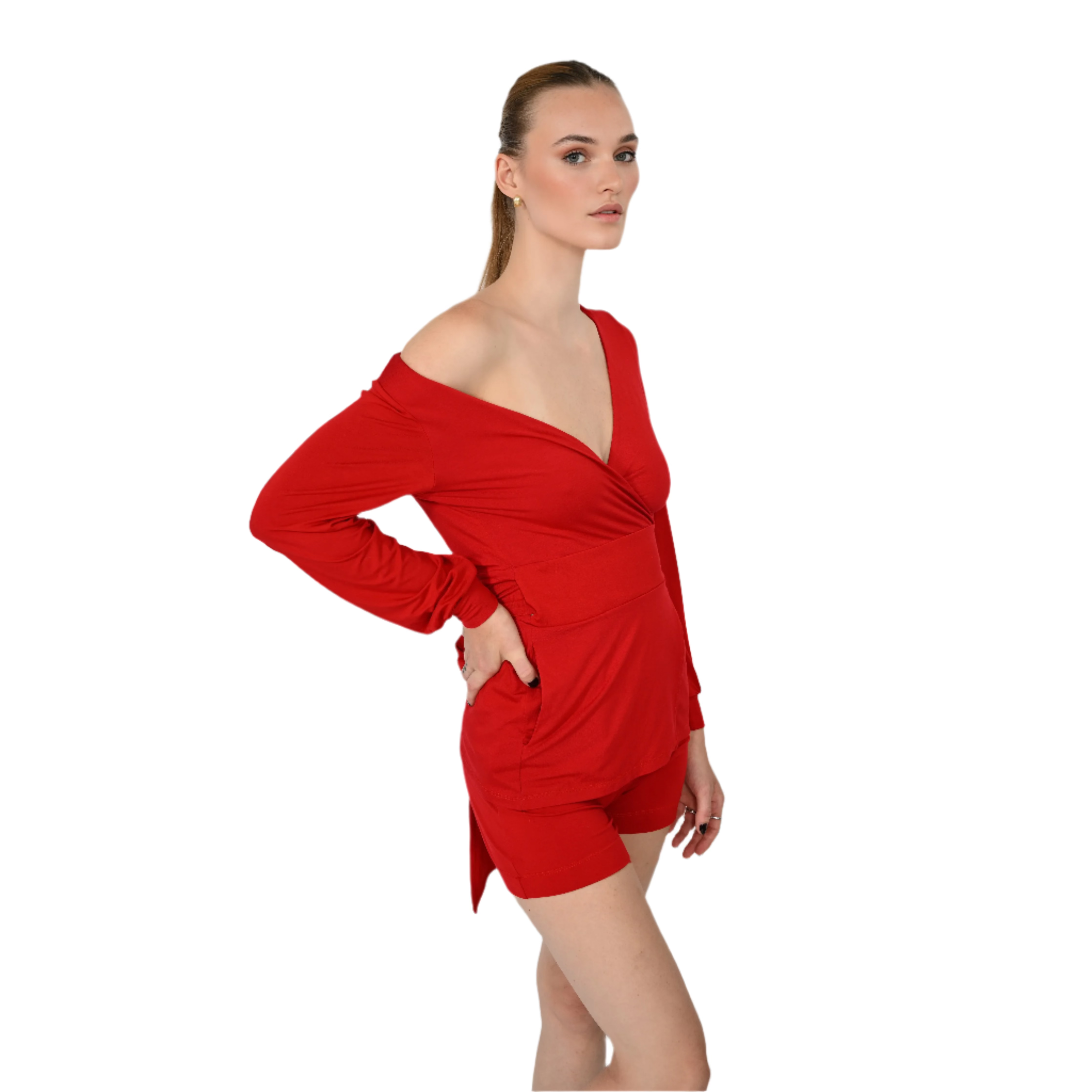 Woman wearing a red shirt with long sleeves and shorts on a white background